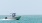 a man driving a boat in water