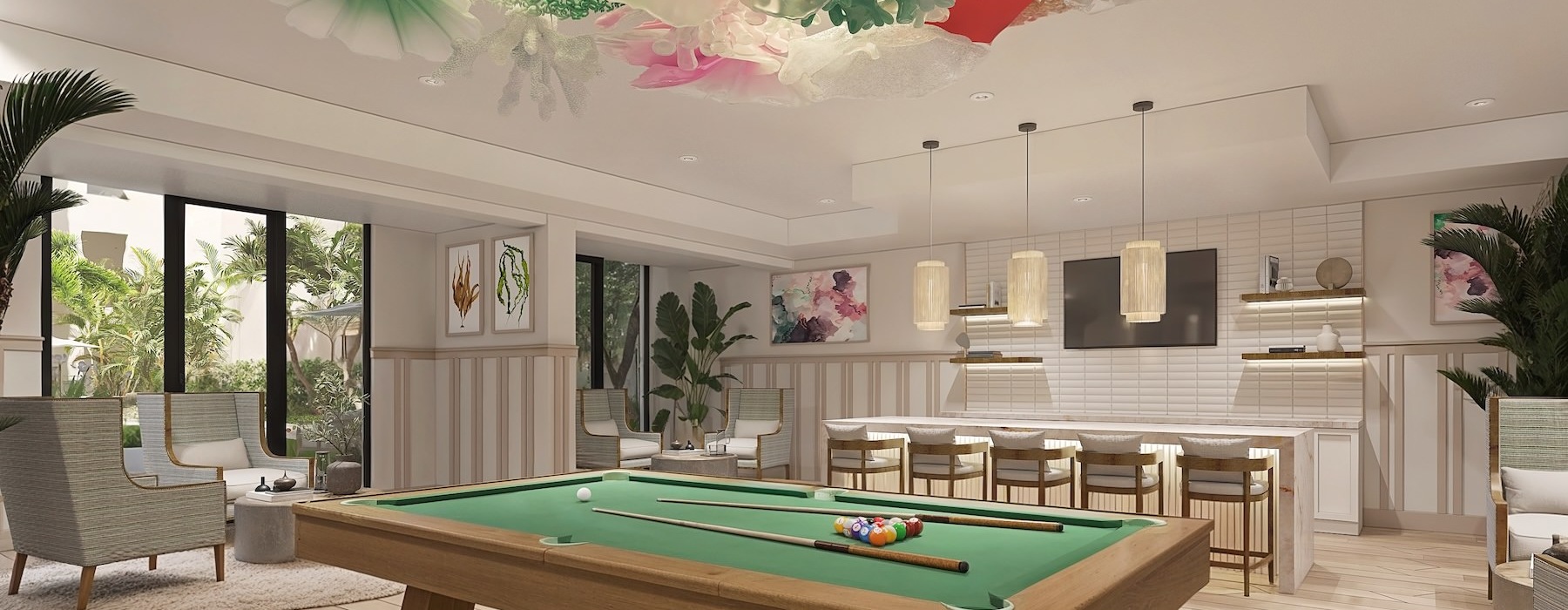 a clubhouse room with a pool table and chairs
